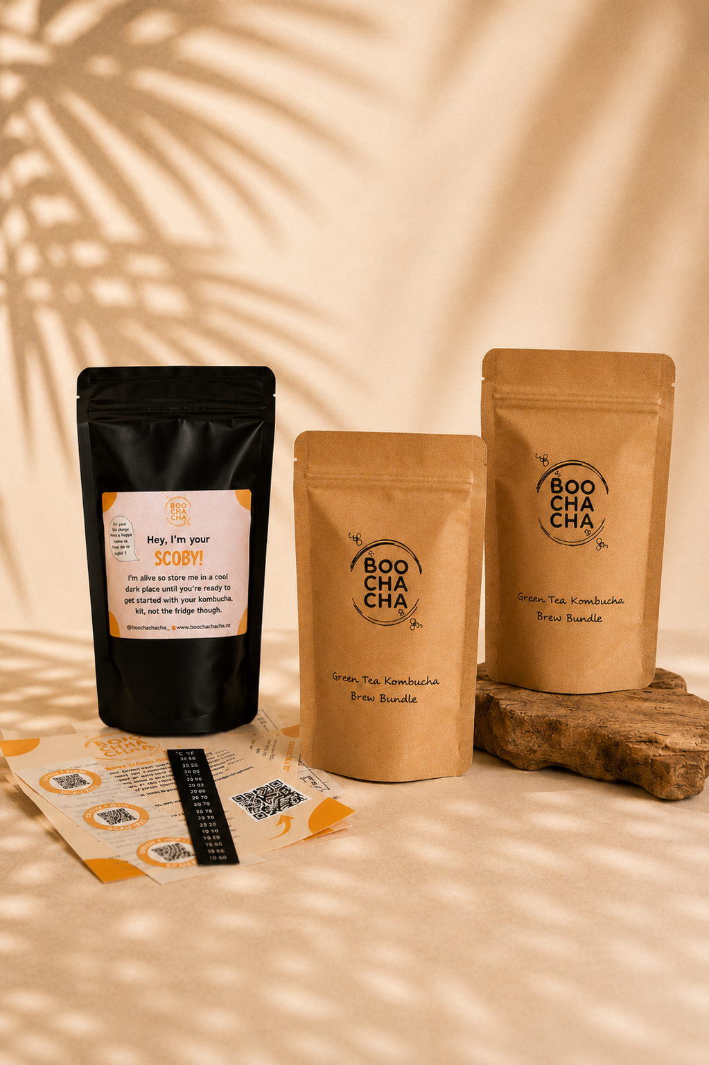 Three Boocha tea packages on a wooden stand with a beige background