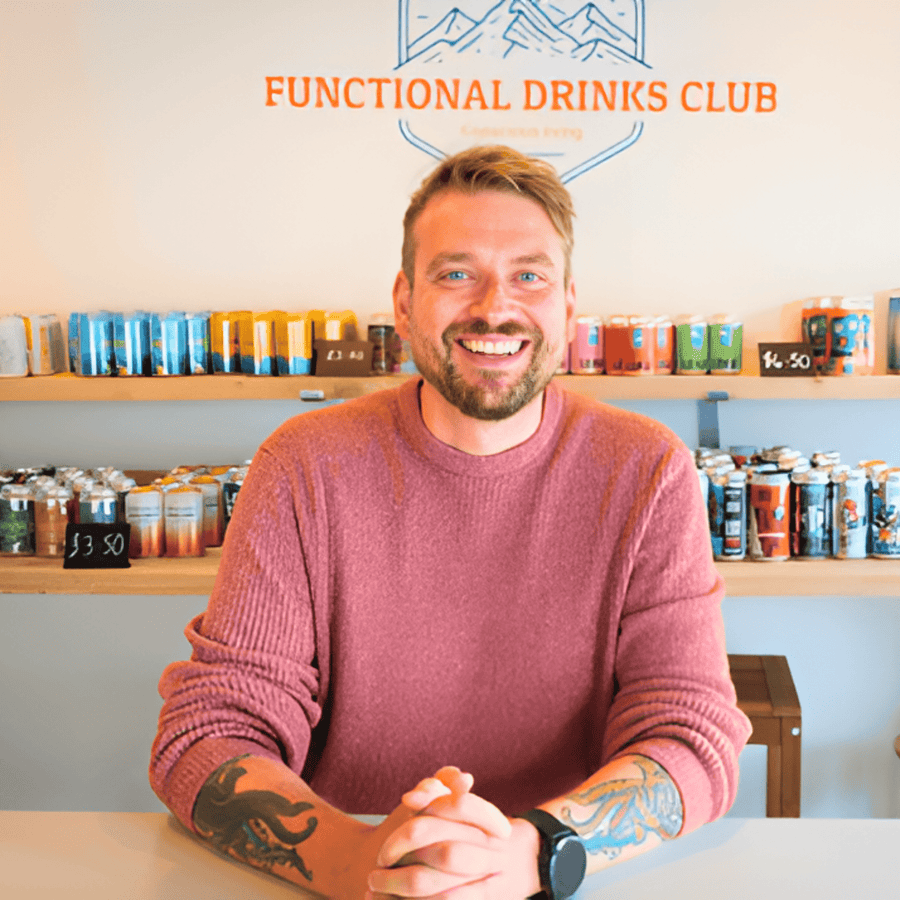 Kev the Founder of Functional Drinks Club in Otley sat at a table.