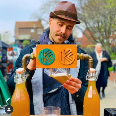 Kompassion Kombucha being poured on draught
