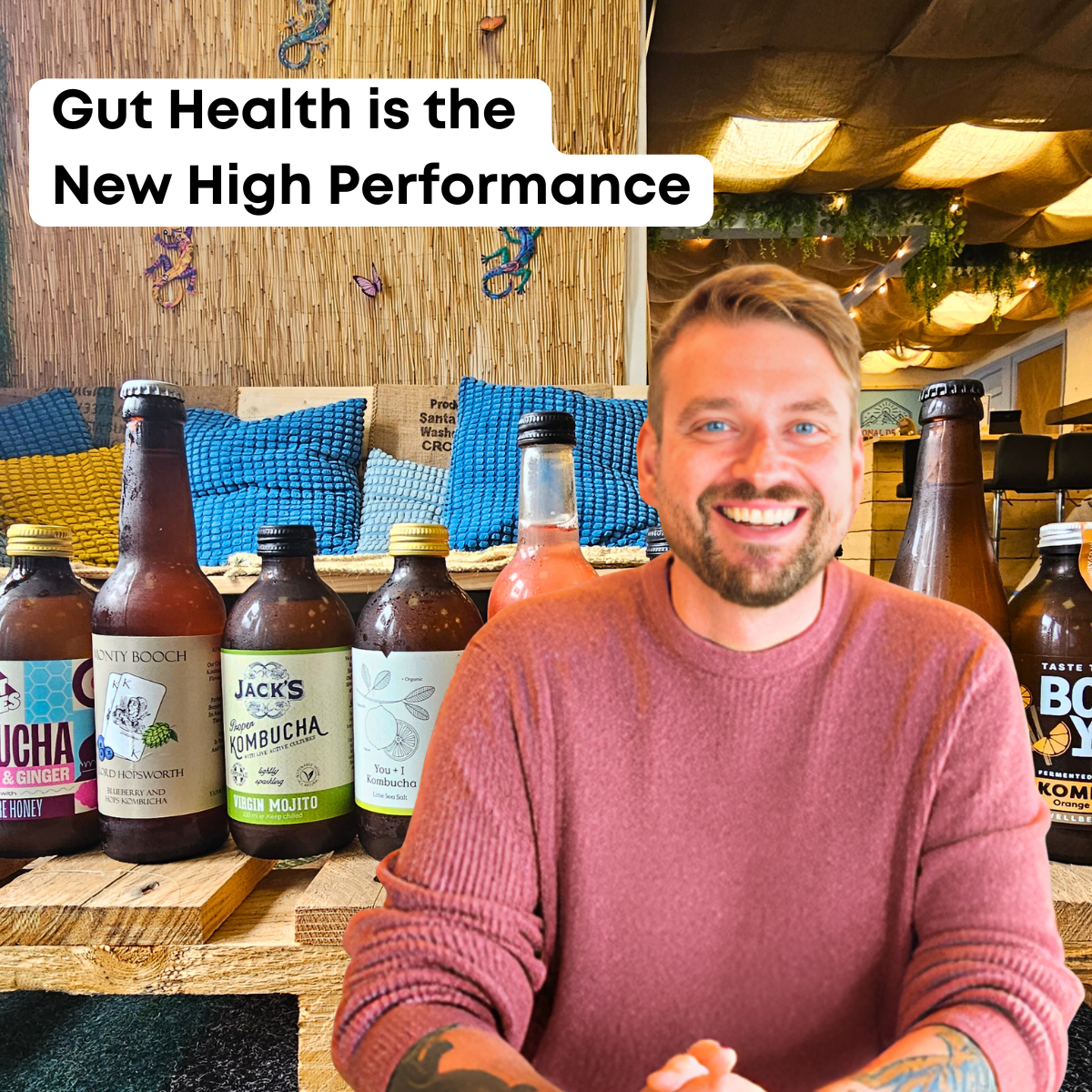 Man sitting at a table with various bottles of juice and drinks, with text 'Gut Health is the New High Performance' above.