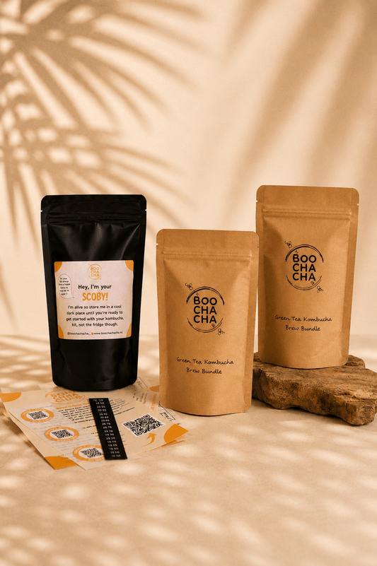Three Boocha tea packages on a wooden stand with a beige background