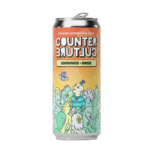 Counter Culture Lemongrass & Ginger raw kombucha in a 330ml can with a silver cap and an orange-to-mint illustrated label.