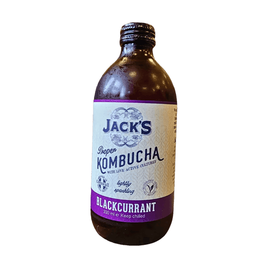 Jack's Blackcurrant raw kombucha in an amber 330ml glass bottle with a black cap and a cream label with a purple flavour band.