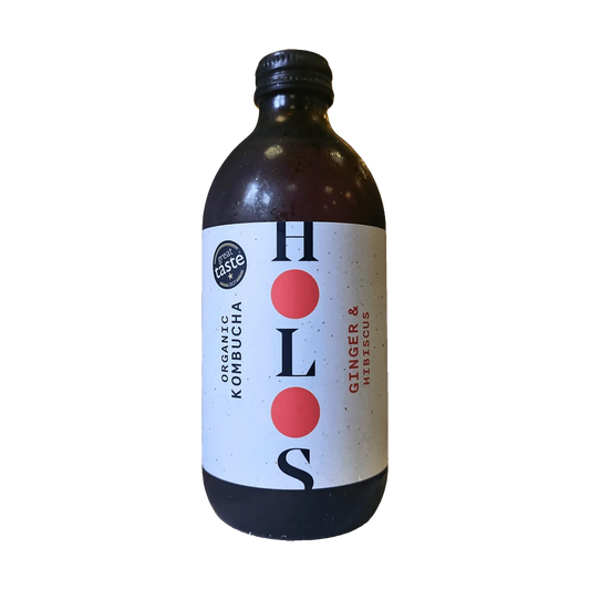 A dark bottle of HOLOS Ginger and Hibiscus organic kombucha with a white label and red dots.