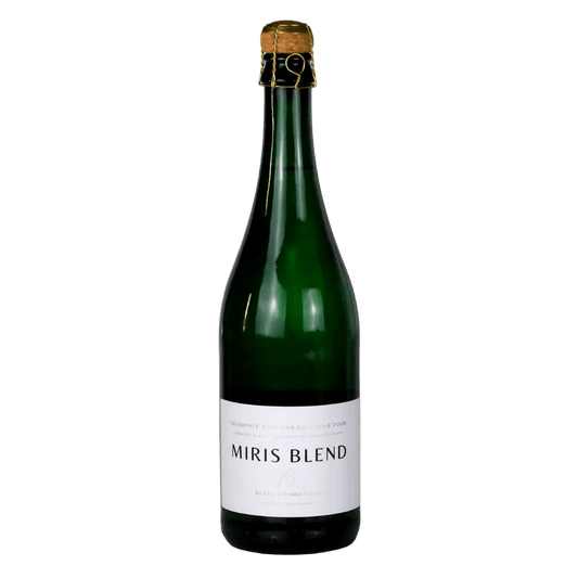 A bottle of Miris Blend sparkling wine in a dark green glass bottle with a white label and a gold foil seal, set against a plain white background.