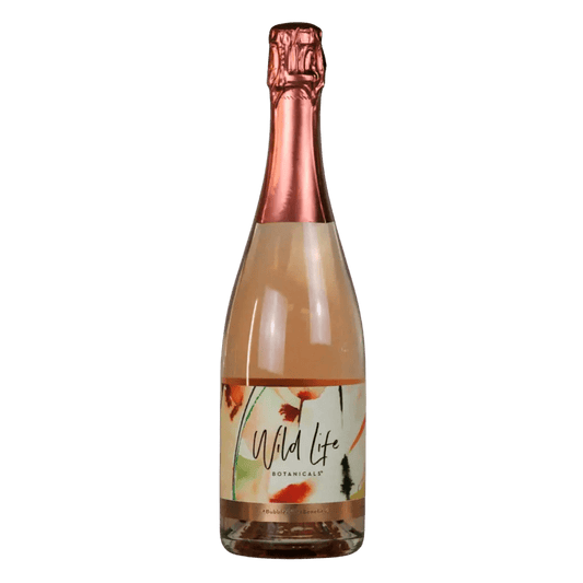 A bottle of Wild Life Botanicals sparkling wine with a copper-colored foil top and a colorful botanical label, set against a plain white background.